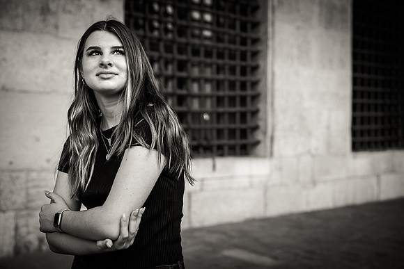 Mother posing for a black and white portrait during a family photo session in Venice