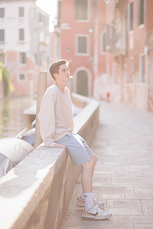 Individual portrait of a family member along the Cannaregio canal in Venice
