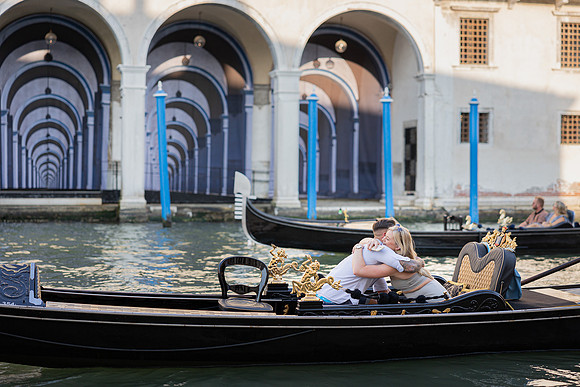 An intimate moment of love and joy as a couple gets engaged in Venice.