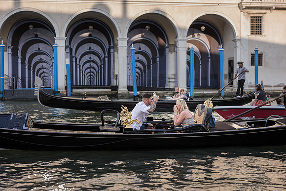 A picture-perfect engagement on a gondola ride through the historic canals.