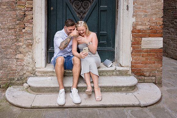 A soft embrace and a joyful tear after saying yes in Venice.