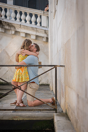 Couple hugging after a proposal near the Rialto Bridge