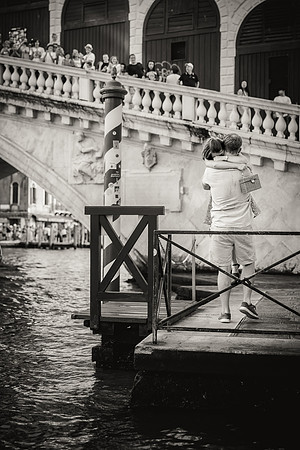 Black and white engagement photo near Rialto Bridge