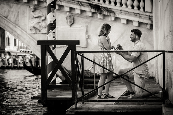 Couple walking together after a surprise proposal in Venice