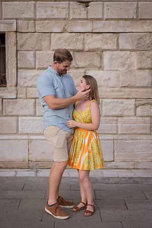 Couple embracing near a rustic Venetian wall
