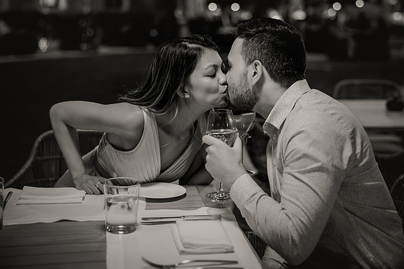 Engaged couple having a candlelit dinner in Venice