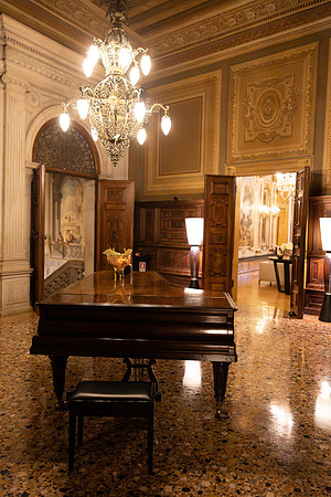 Elegant interior with grand piano at Hotel Aman