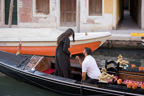 Black gondola floating on a Venice canal