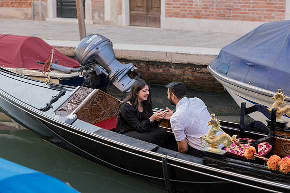 Couple sitting in a gondola in Venice