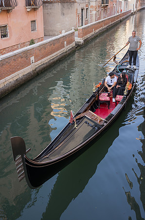 Couple kissing on a gondola in Venice
