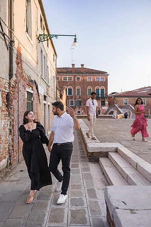 Couple hugging in a Venetian square