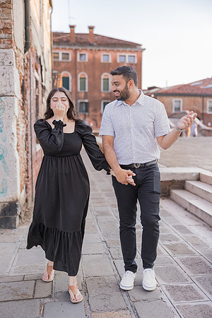 Smiling couple in the light of Venice