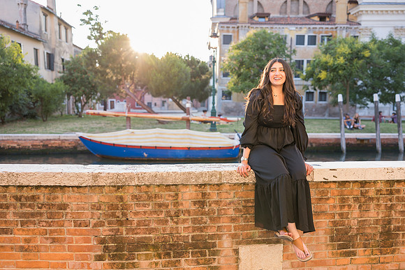 Couple posing in front of Venetian architecture