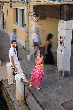 Couple posing elegantly in Venice