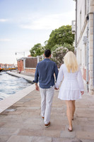 Reflection of a couple standing near Punta della Dogana in Venice.