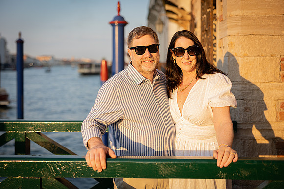 Family portrait on a Venetian bridge during summer vacation.