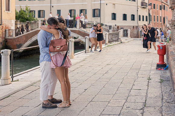 Couple walking in Cannaregio after proposal in Venice.