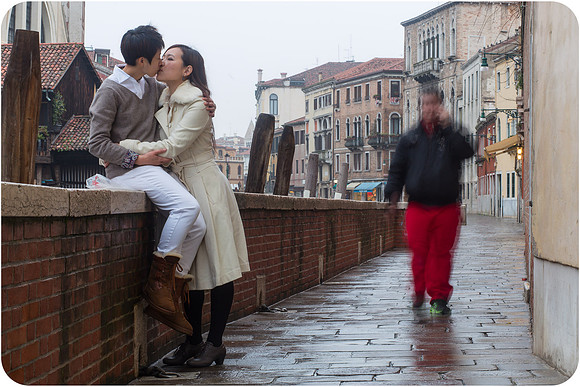 Lesbian couple celebrating their honeymoon in Venice, embracing love in a stunning setting.