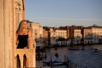 Couple posing under Venetian streetlights