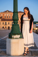 Romantic kiss beneath Venetian lamp