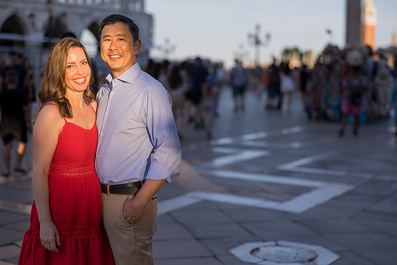 Family portrait taken at night in St. Mark's Square, Venice, capturing a beautiful moment.