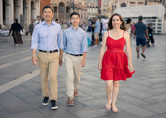 Family walking through St. Mark's Square, Venice, enjoying the historic architecture and atmosphere.