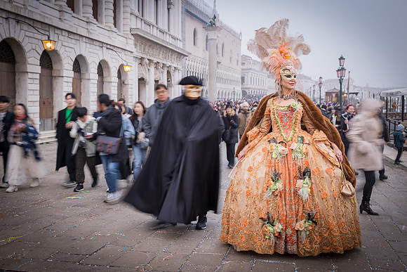 Guest walking through San Marco Piazza during Venice Carnival