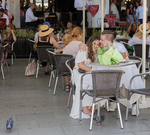 Engaged couple enjoying coffee at Café Florian