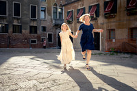 Family walking through quiet Venice streets