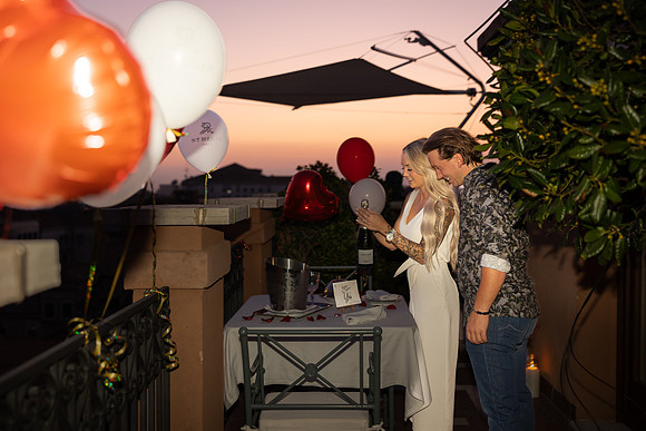 Rooftop celebration at St. Regis Hotel after proposal