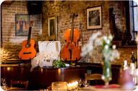 Cozy restaurant with musical instruments displayed during a Venice wedding.