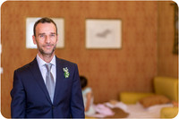 Groom standing and posing in his wedding suit in Venice.