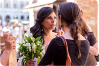 Bride speaking with a friend in Venice after the wedding ceremony.