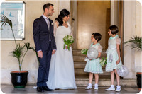 Groom with two young girls in light blue dresses at a wedding in Venice.