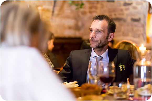 Groom enjoying dinner during the wedding reception in Venice.