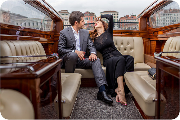 Couple enjoying a romantic water taxi ride in Venice.
