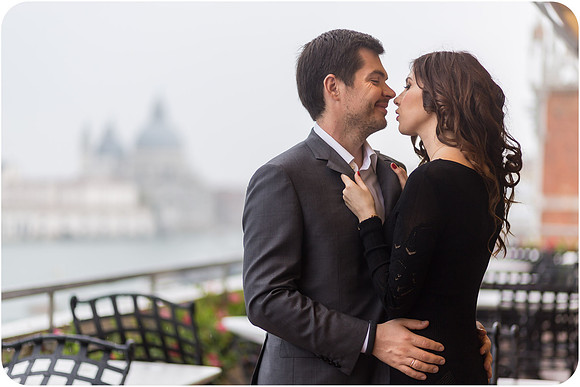 Couple embracing on the terrace of Hotel Danieli in Venice.