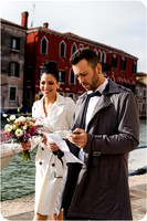 Bride and groom reviewing ceremony details