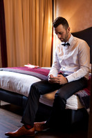 Groom preparing in Venice hotel room