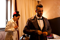 Groom putting on bow tie Venice