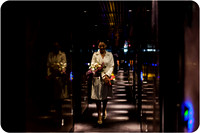 Bride walking through Venice hotel corridor