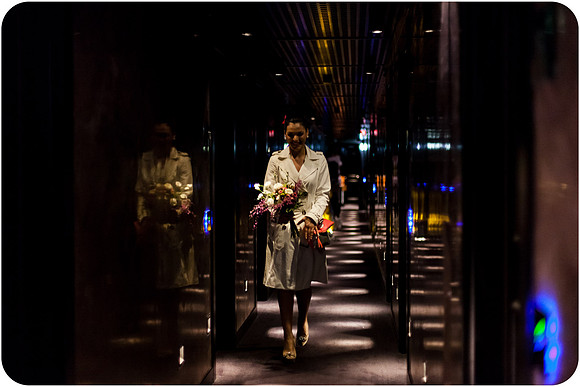 Bride walking through Venice hotel corridor