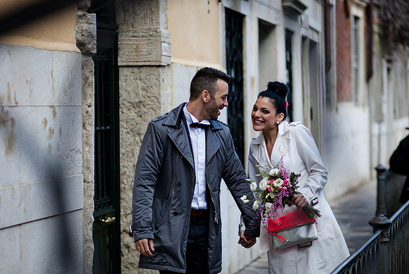 Couple walking hand in hand Venice alley