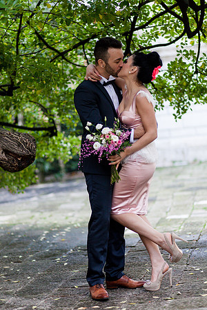 Bride groom embracing bouquet Venice