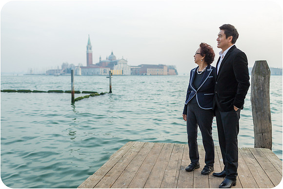 Mother and son standing at the docks in Venice.