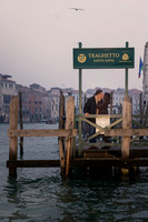Couple walking along the canal as Venice wakes up.