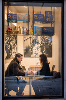 Couple having breakfast inside Rosa Salva café in Venice.
