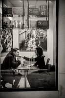 Black and white photo of a couple having breakfast in a Venetian café.