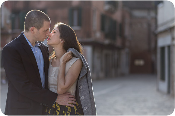 A romantic portrait of a couple with soft lighting in Venice