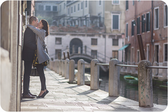 Couple standing in a narrow, historic Venetian street